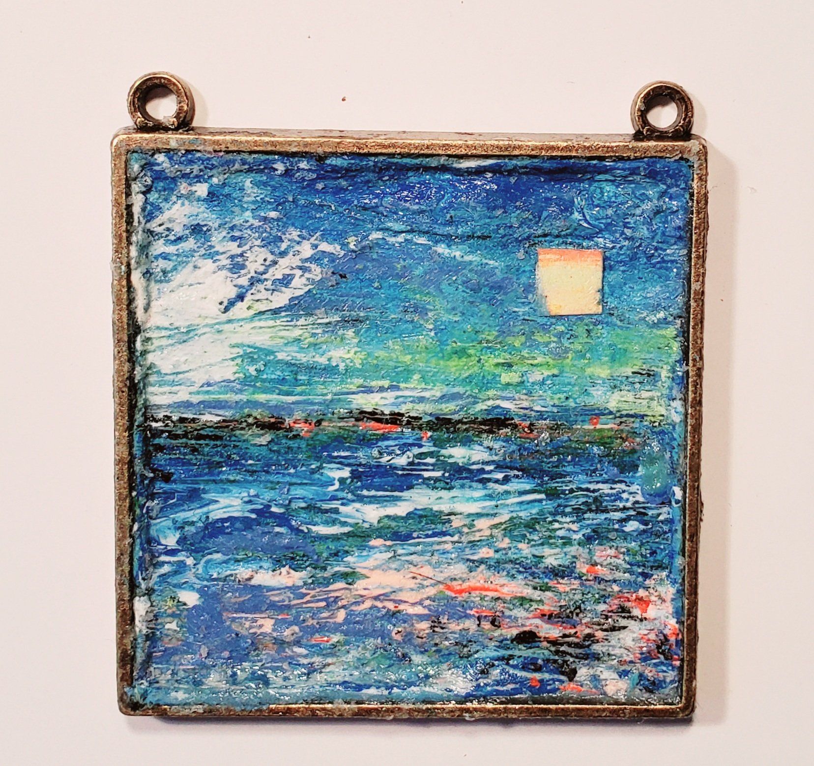 A painting of a sunset over a body of water