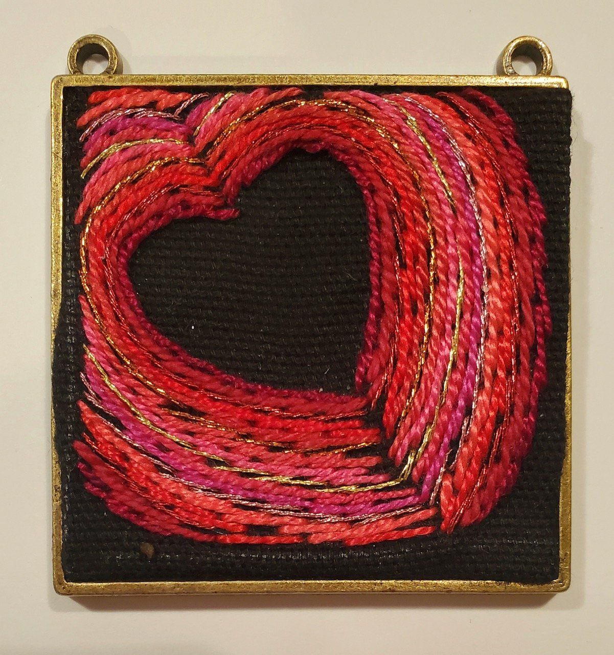 A painting of a red heart on a black background