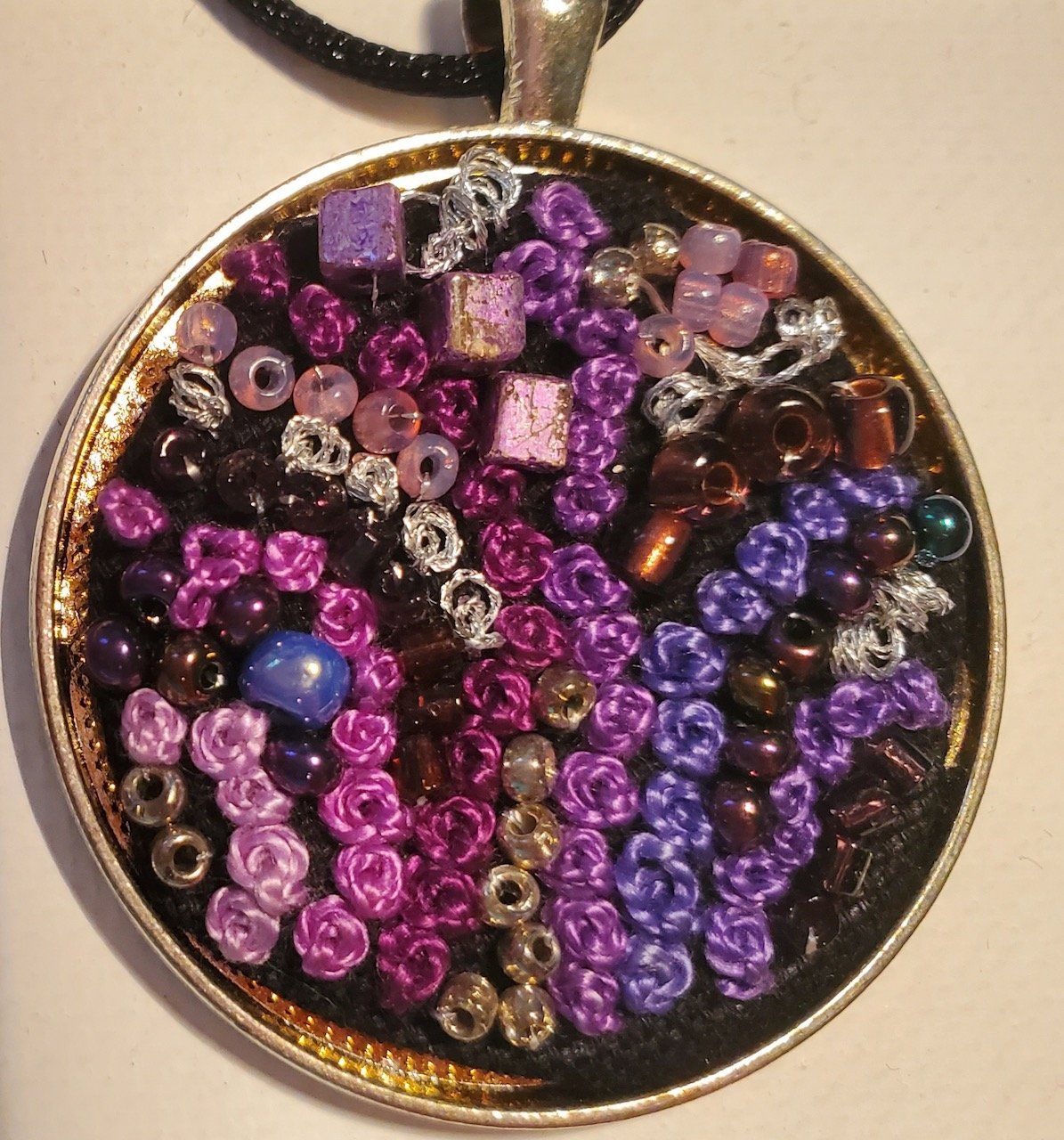 A necklace with purple and brown beads on it