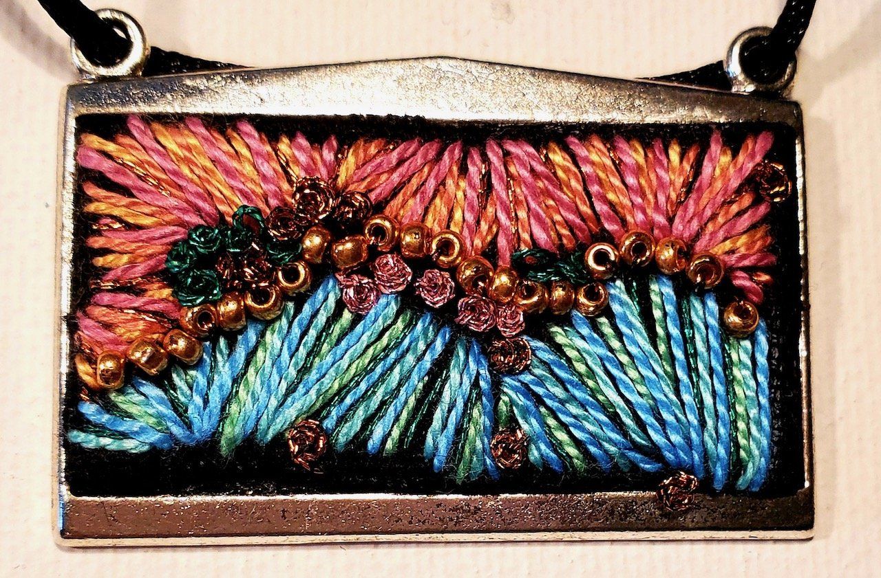 A necklace with a colorful design on it