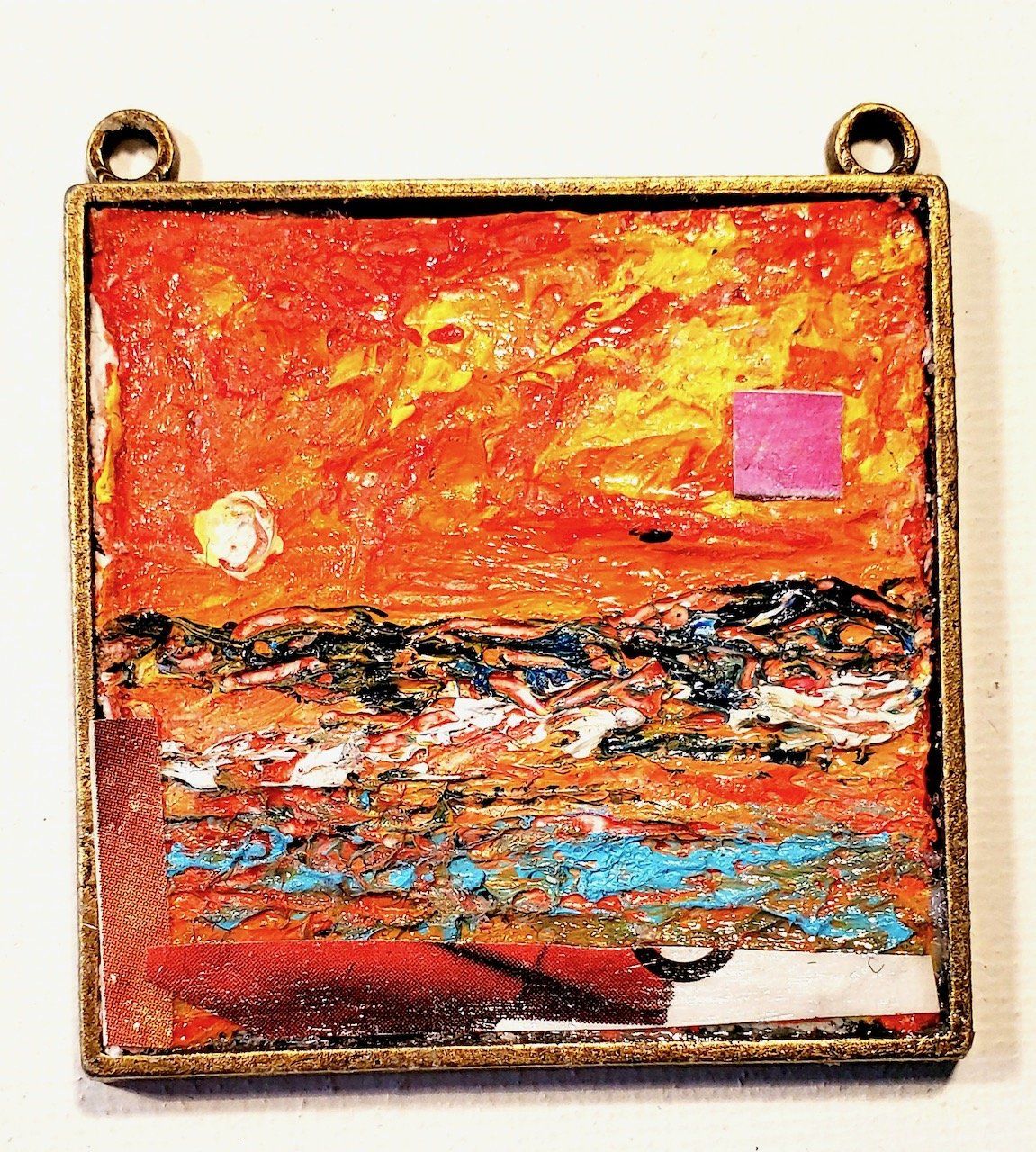A painting of a sunset with a pink square in the middle