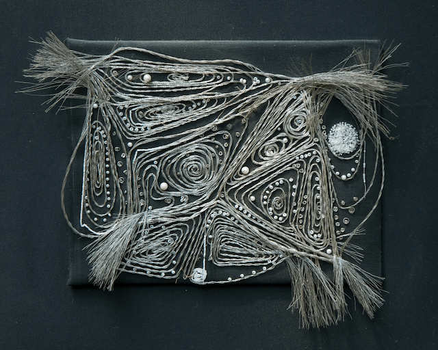 A black and white painting with a geometric design on it