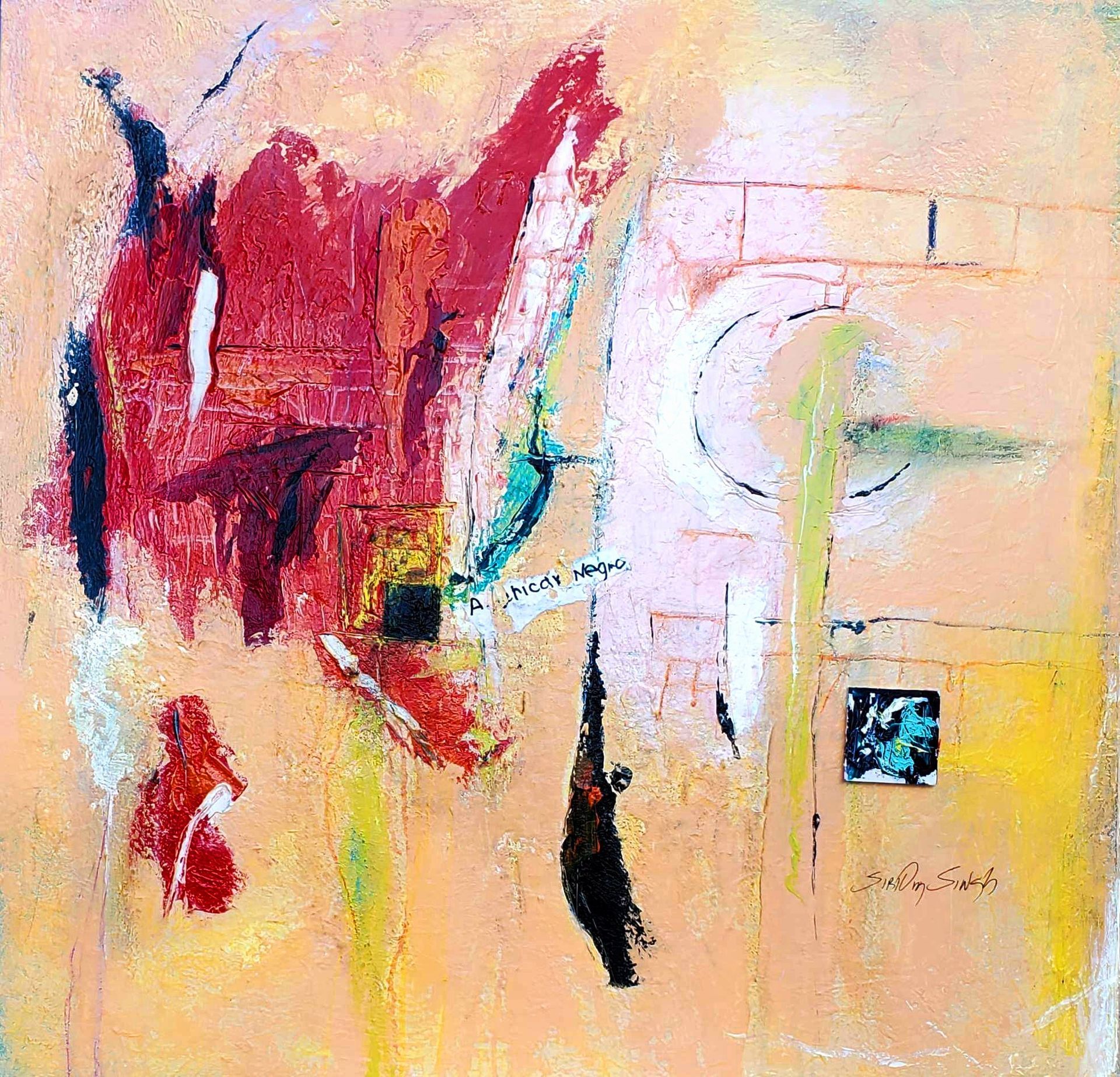 A man with a beard is standing in front of three paintings on a wall.