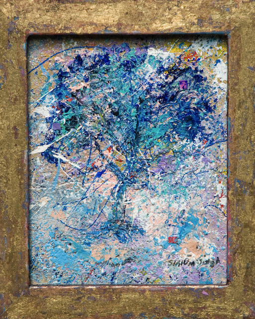 A painting of a tree in a gold frame