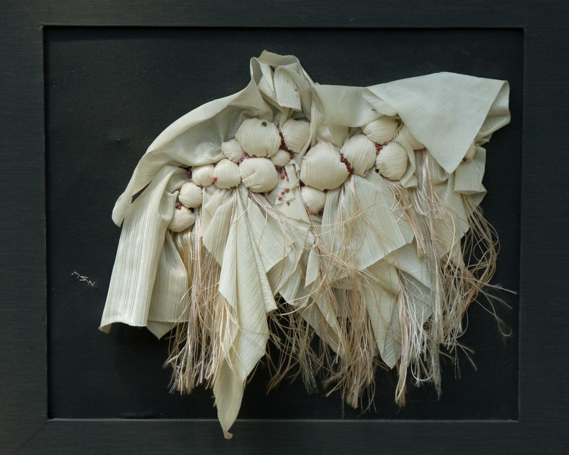 A piece of cloth with a bunch of white flowers on it