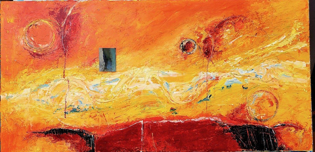 A close up of a painting on a canvas on a table.