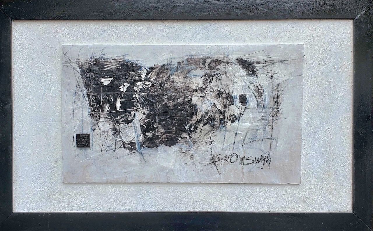 A black and white painting is in a black frame.