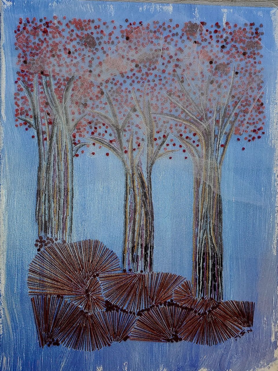A painting of three trees with red leaves on a blue background.