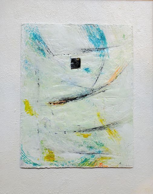 A small painting is hanging on a white wall.