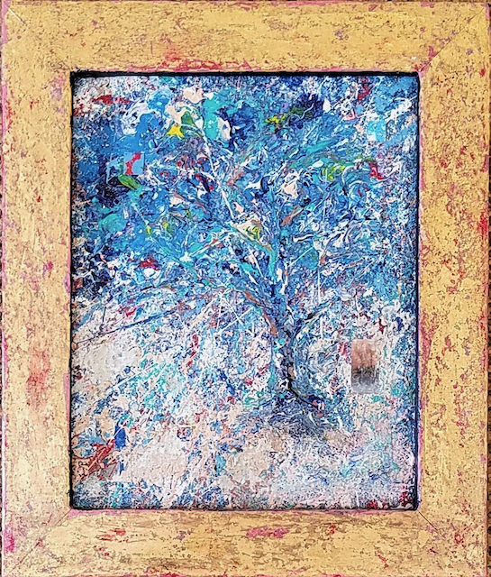 A painting of a tree in a gold frame.