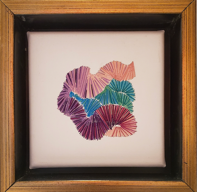 A painting of a bunch of flowers in a wooden frame