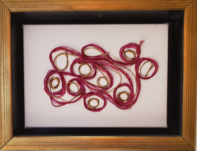 A framed picture of a bunch of circles on a white background