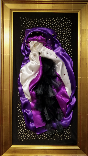 A painting of a purple white and black object in a gold frame