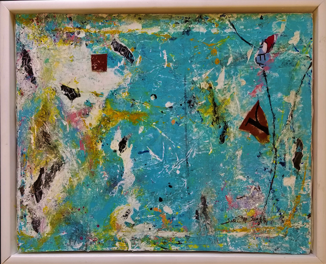 A colorful painting is in a white frame.