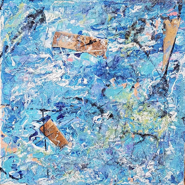 A close up of a blue and white painting on a wall.