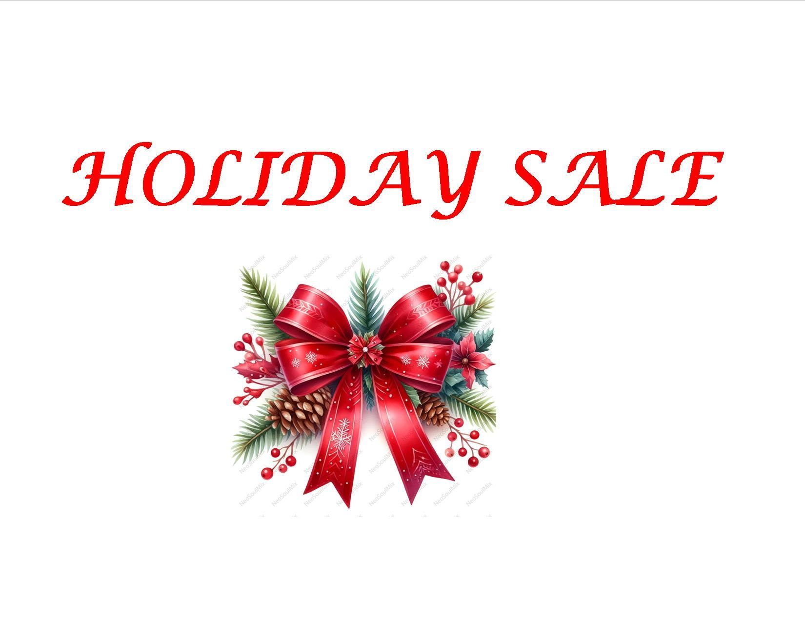 A man with a beard is standing in front of three paintings on a wall.