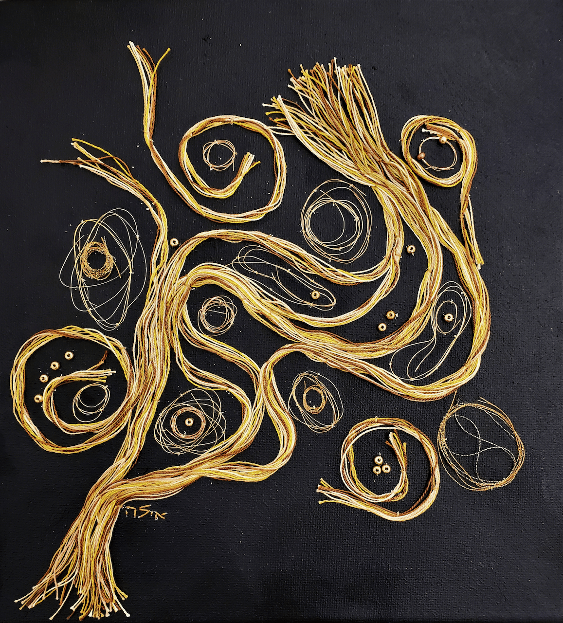 A painting of a tree made of gold threads on a black background