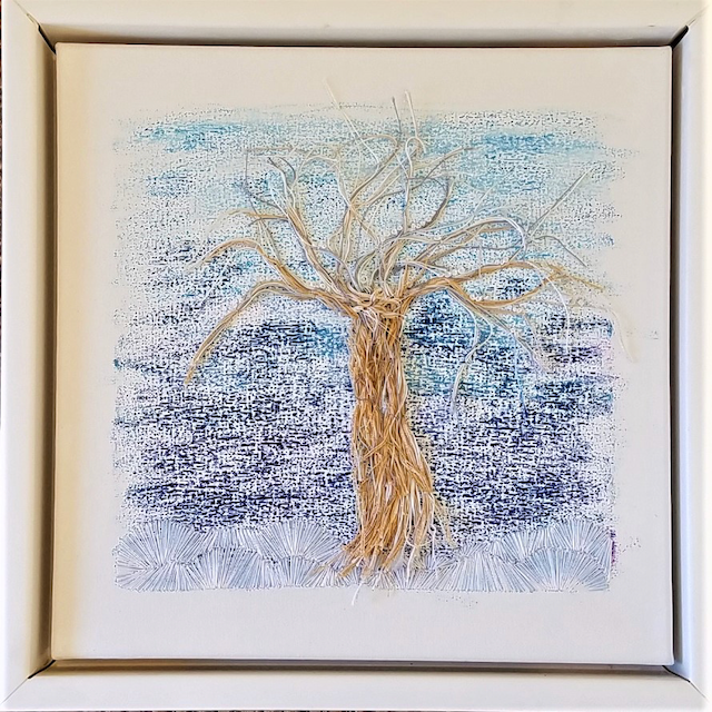 A painting of a tree without leaves in a white frame.