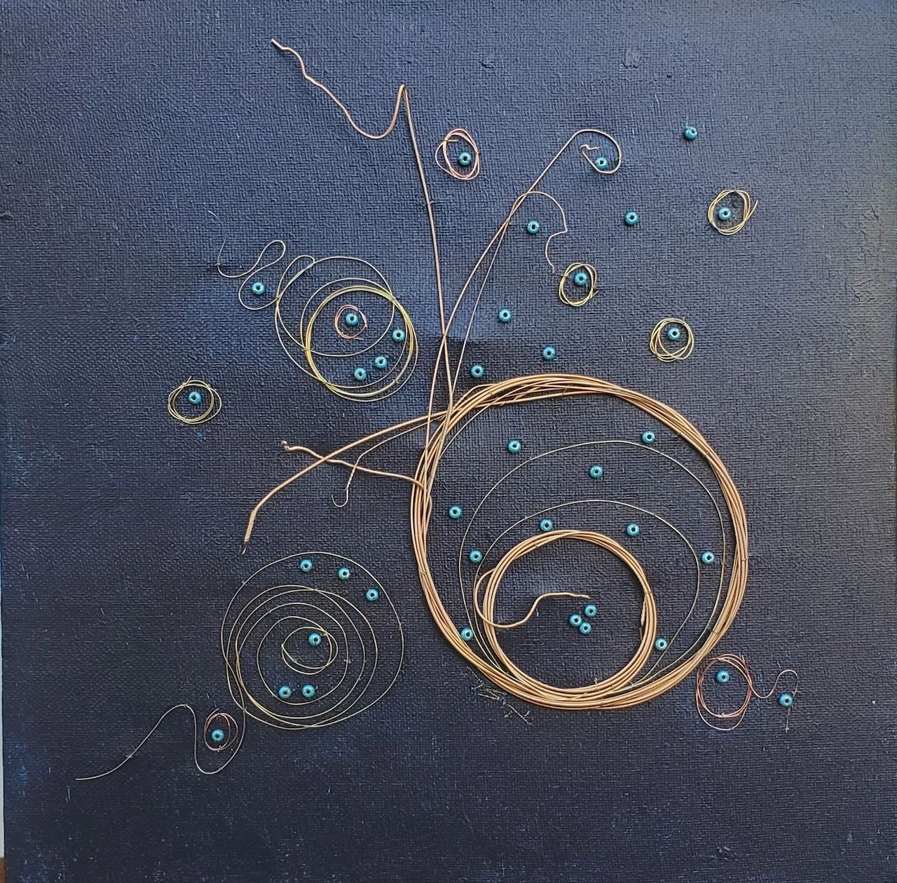 A painting of circles and beads on a blue background