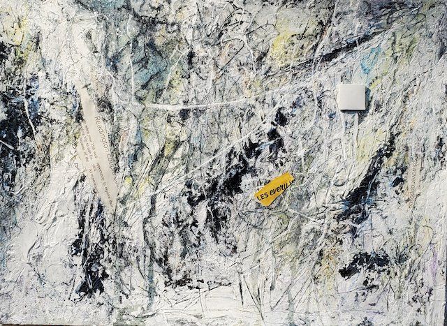 A close up of a painting with a yellow object in the middle.