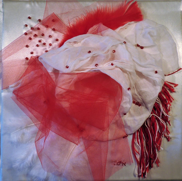 A painting of red and white fabrics with the name tom on the bottom