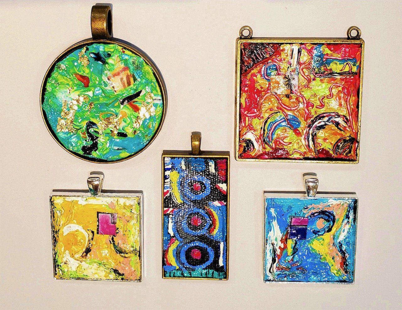 A group of colorful pendants are hanging on a wall