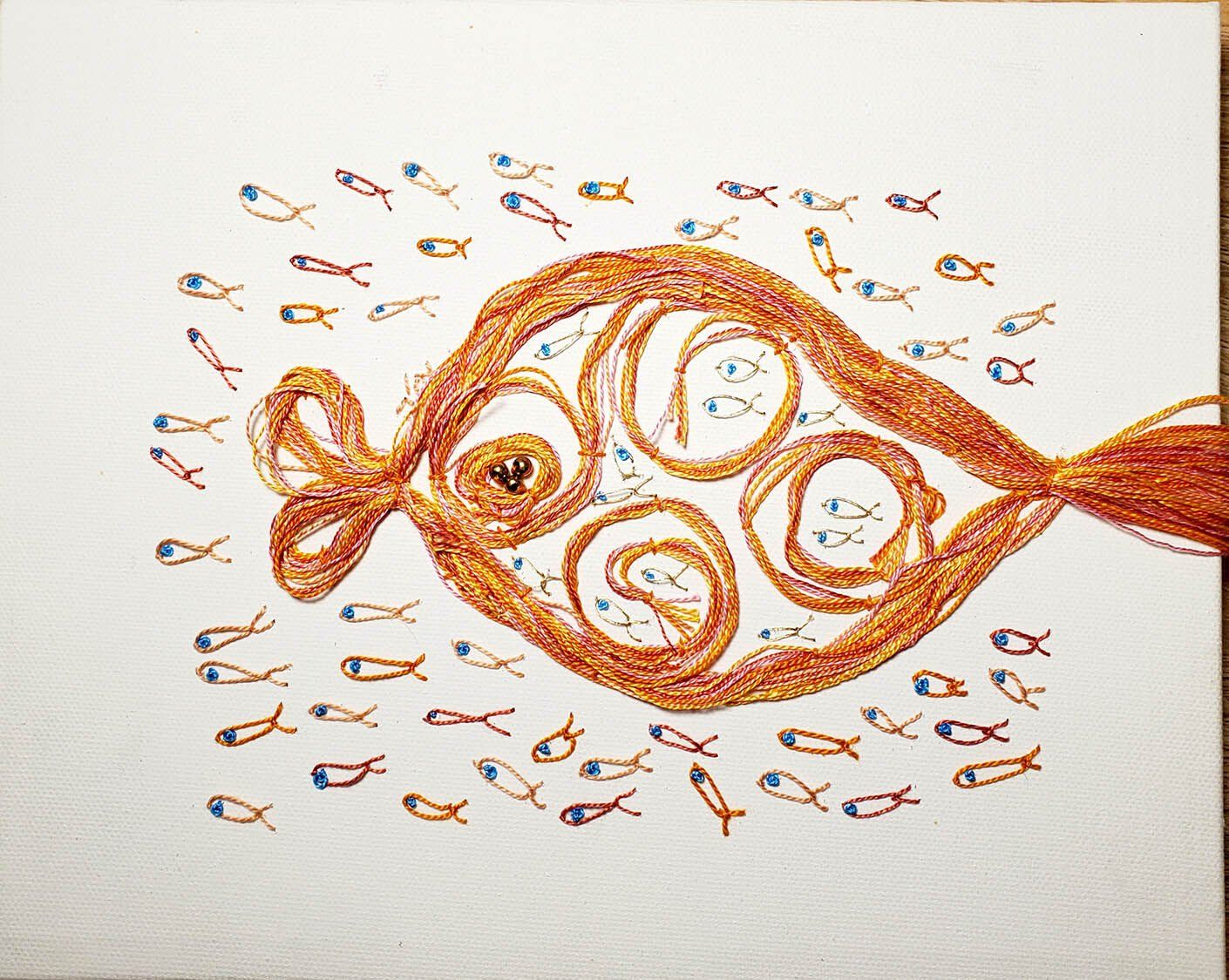 A drawing of a fish surrounded by smaller fish