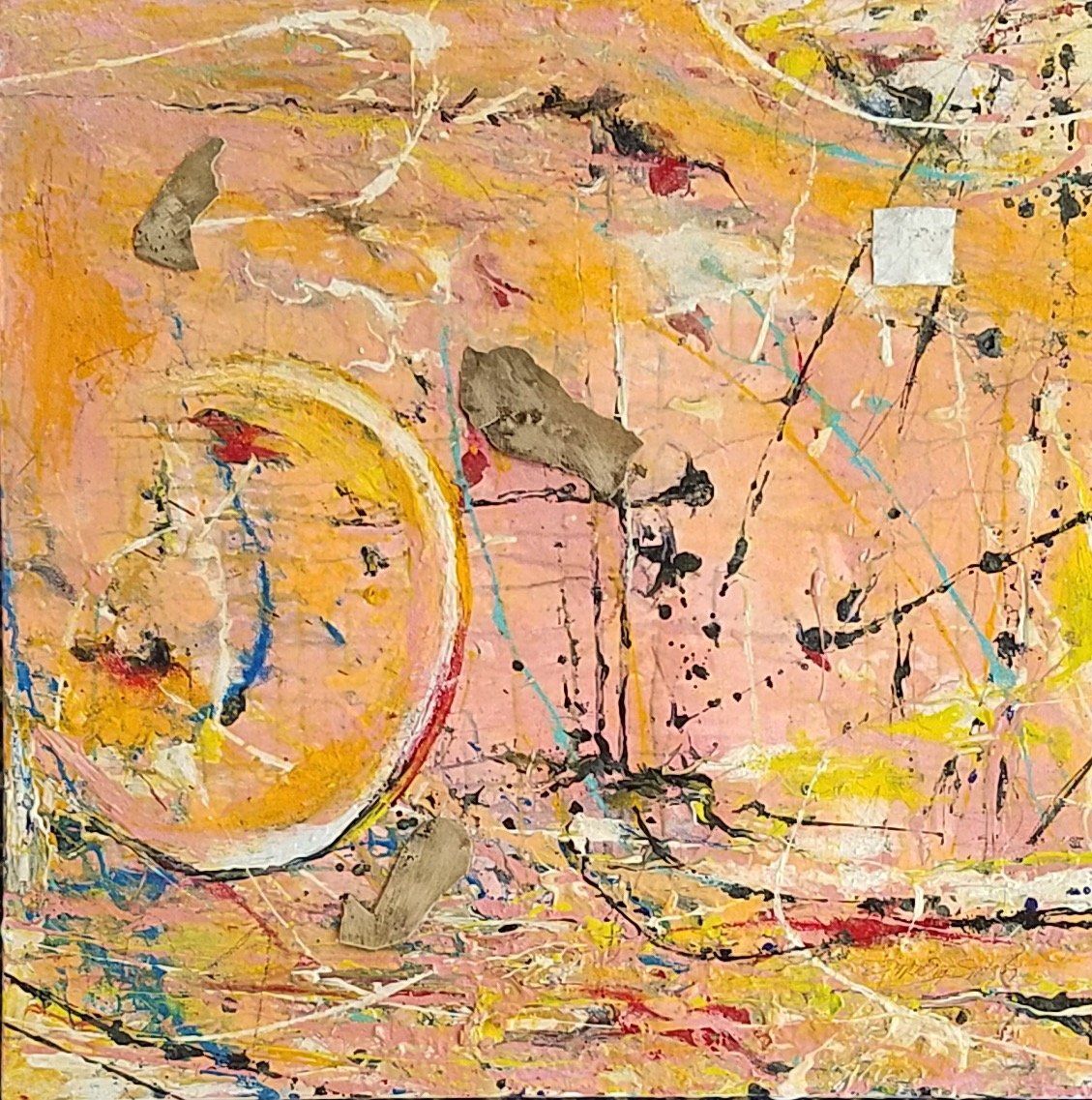 A close up of a colorful painting with a circle in the middle