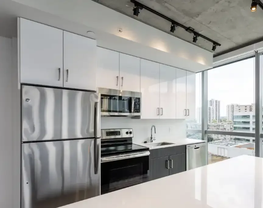 Well-equipped kitchen in a model home at Collective on 4th in Portland, OR.