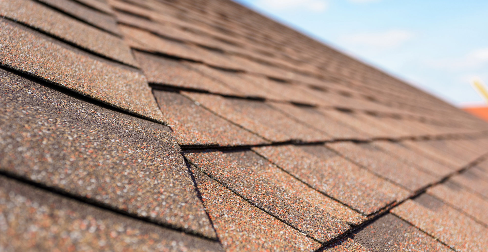 A close up of a roof with shingles on it.