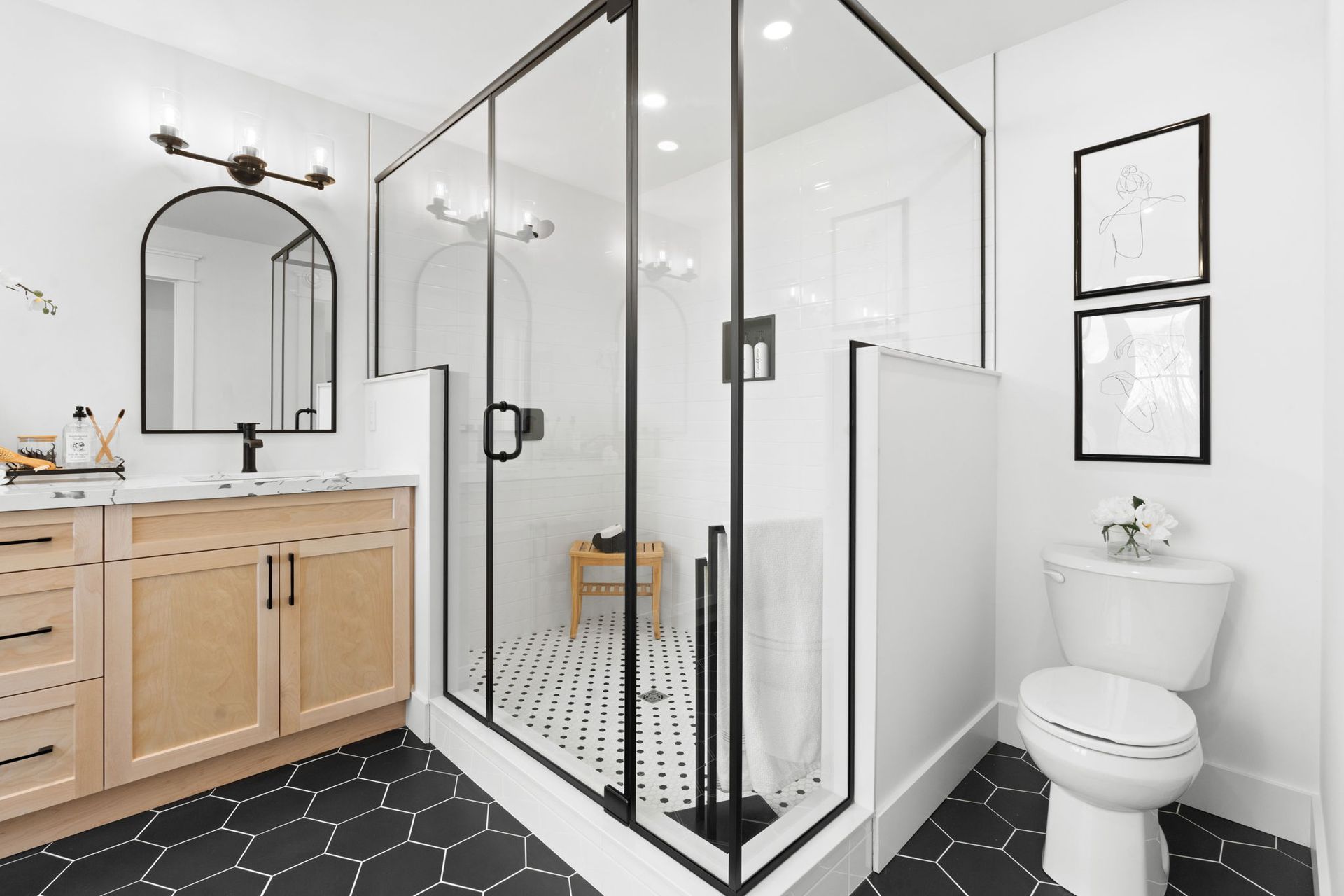 A image of the primary bathroom in the Annika model with a walk in shower and a toilet