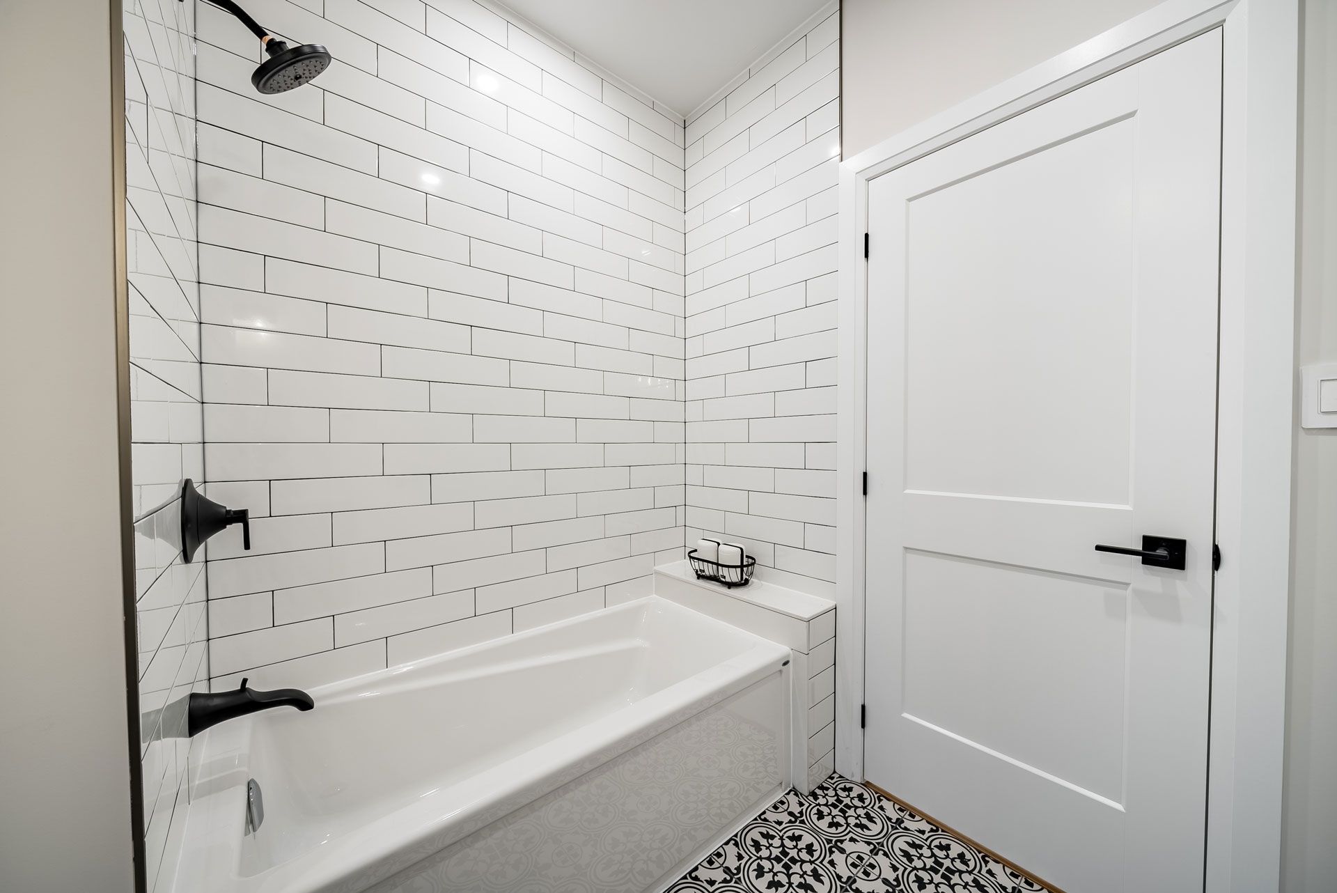 A bathroom with a bathtub and a shower Fidelity Homes Signature build in Cramahe Township