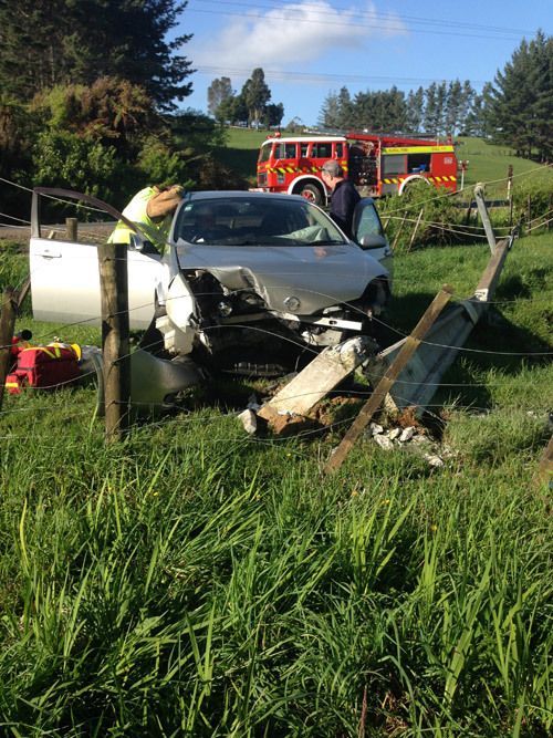 Gray Car Crashed on a Fence — Takanini, NZ — Counties Towing