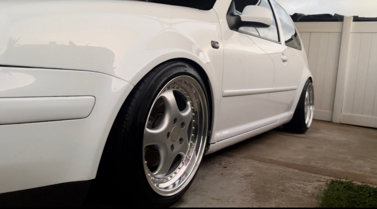 A person is painting a wheel with a marker