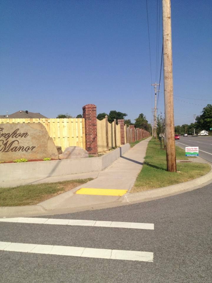 A street corner with a sign that says burlington manor