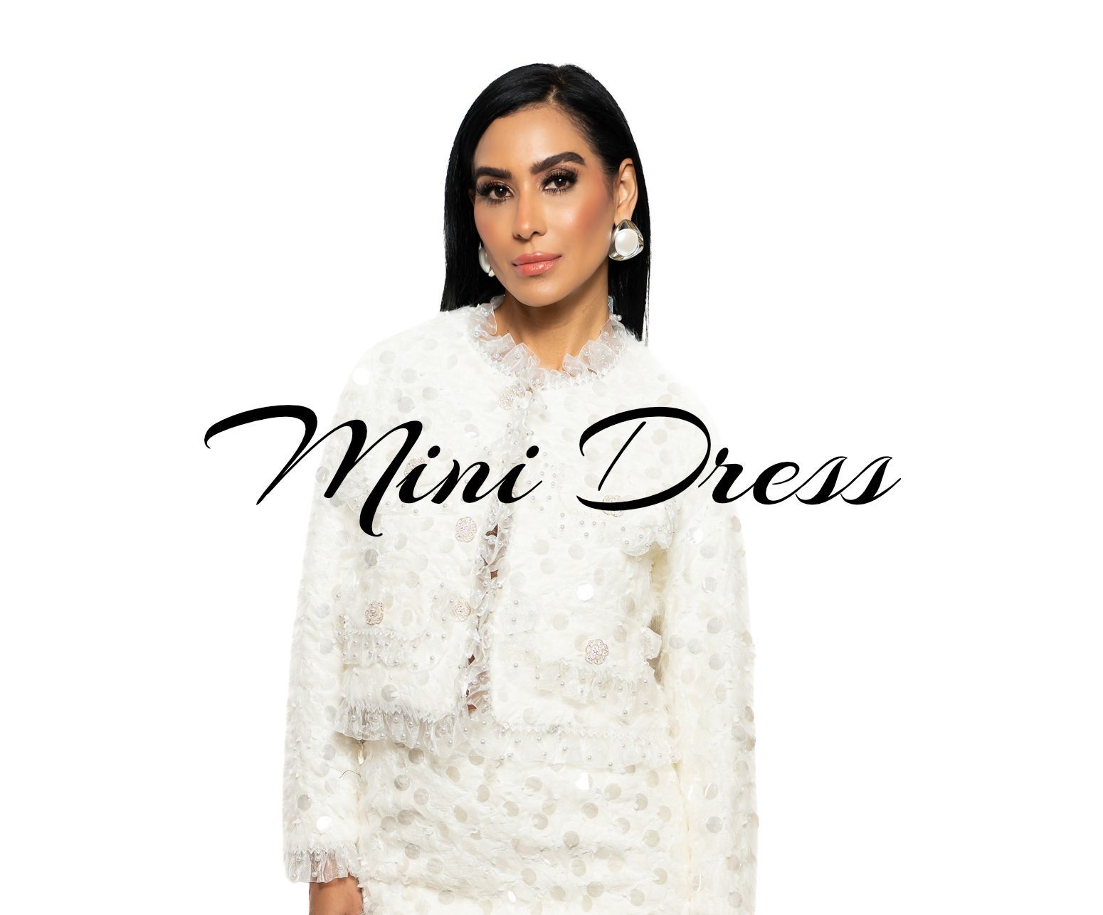 women in a white mini dress standing in a white background