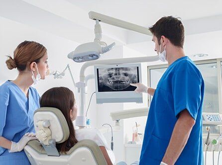 Dentist Checking the Dental X-Ray - TMJ Treatment in Lynbrook, NY