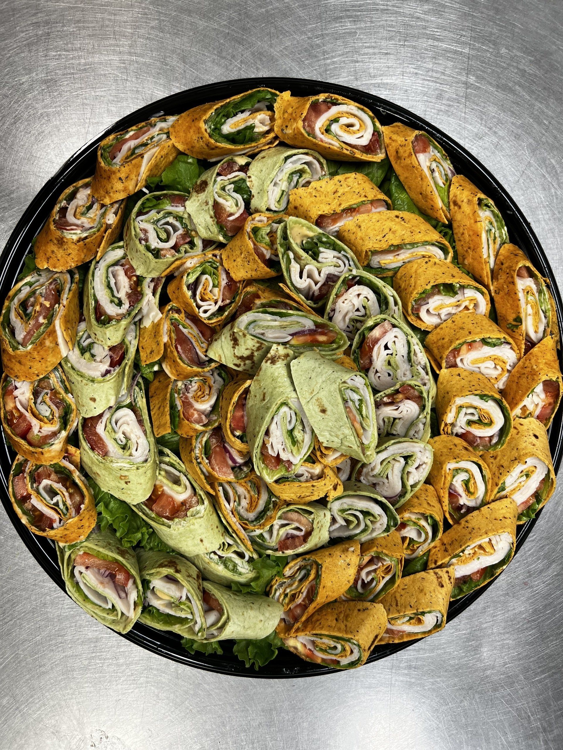 party platter with meat and cheese wraps