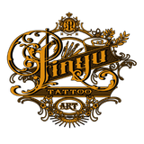 Sin Yu Tattoo Art logo with ornate gold and black filigree. Includes stylized text, brushes and laurel.