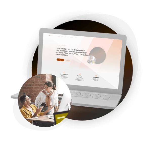 Laptop displaying website with two people collaborating nearby.