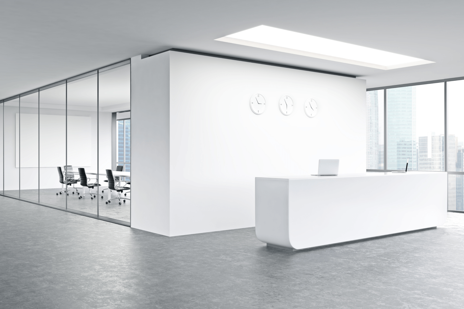 A modern office with a white reception desk and a conference room.