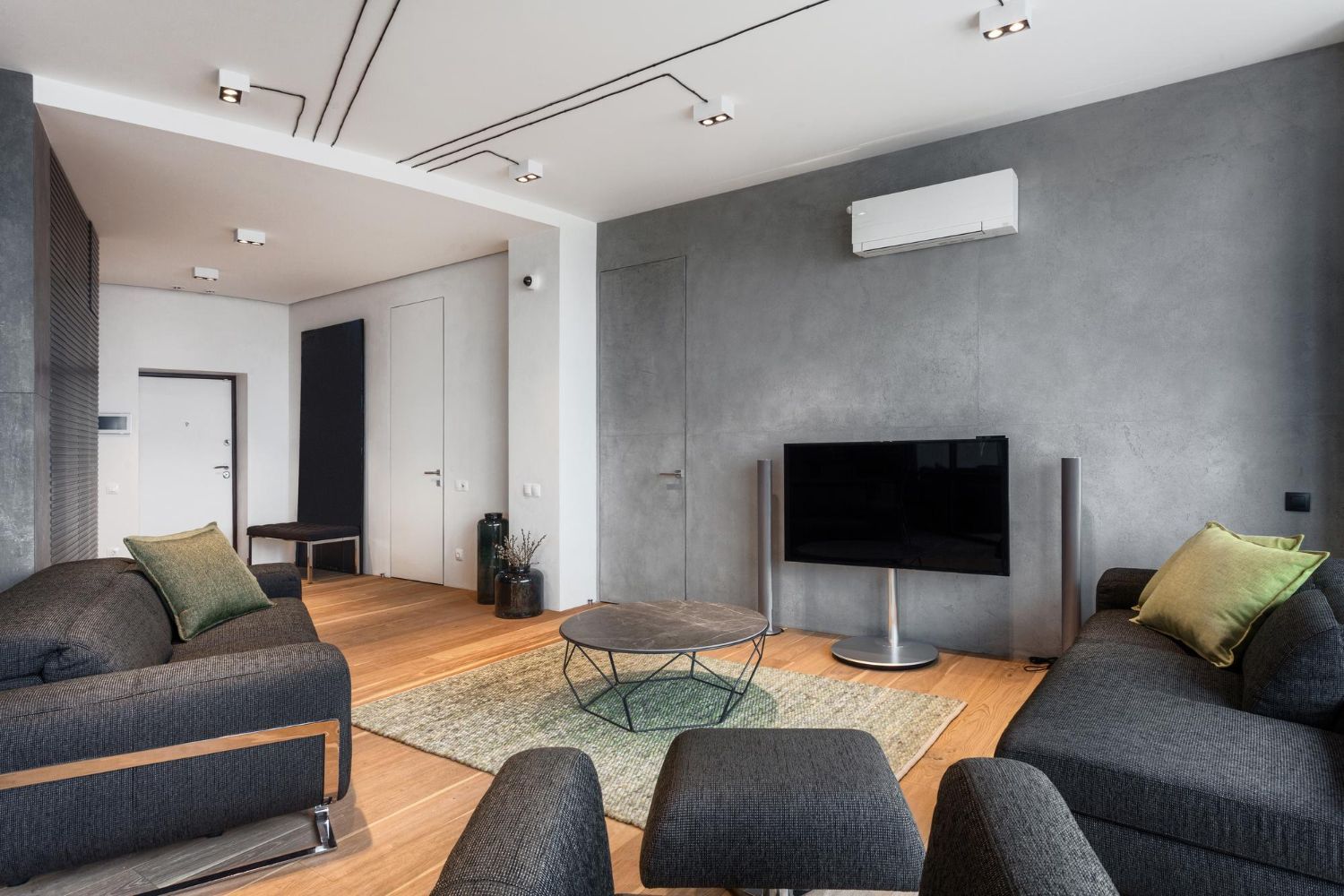 A living room filled with furniture and a flat screen tv.