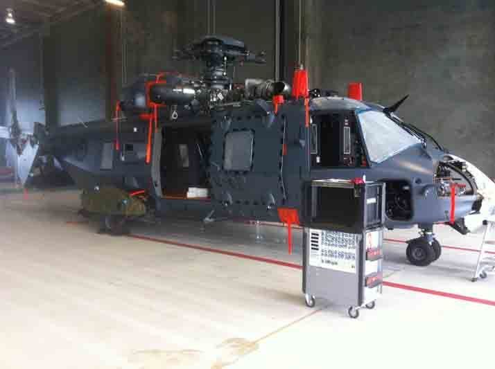 Helicopter being repaired