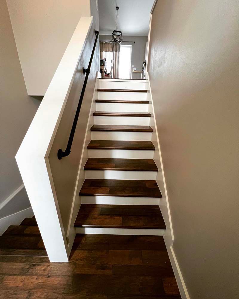 A set of stairs leading up to the second floor of a house.