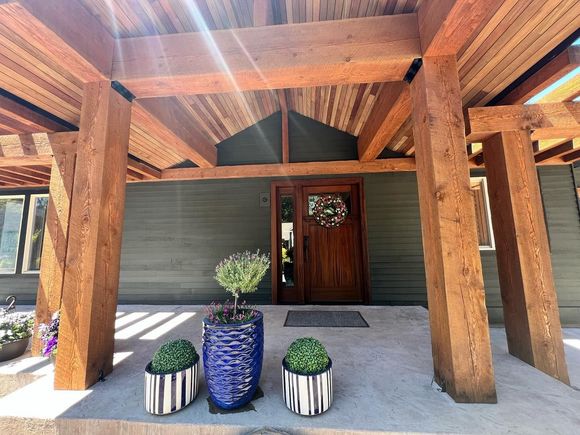 A house with a wooden porch and a wooden door