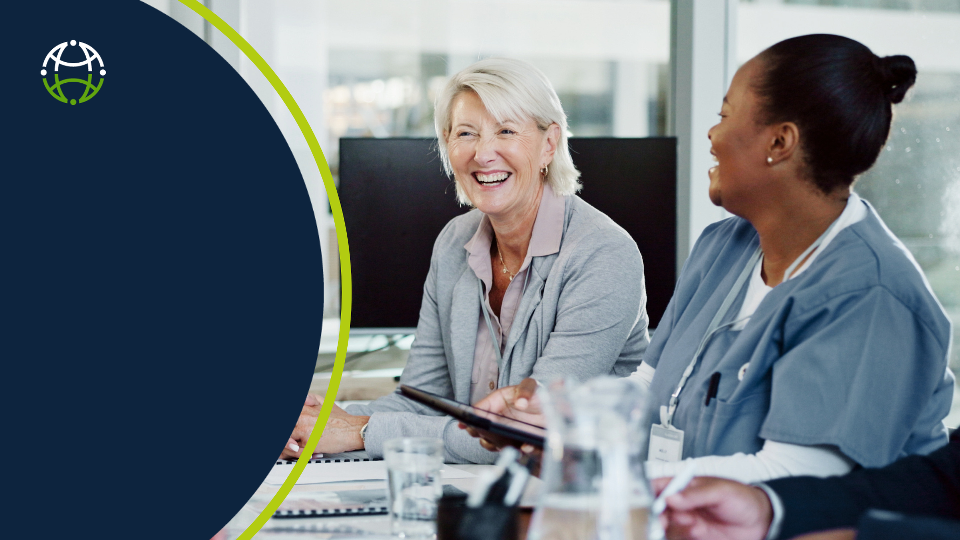 Healthcare  manager and health employee sitting side by side smiling