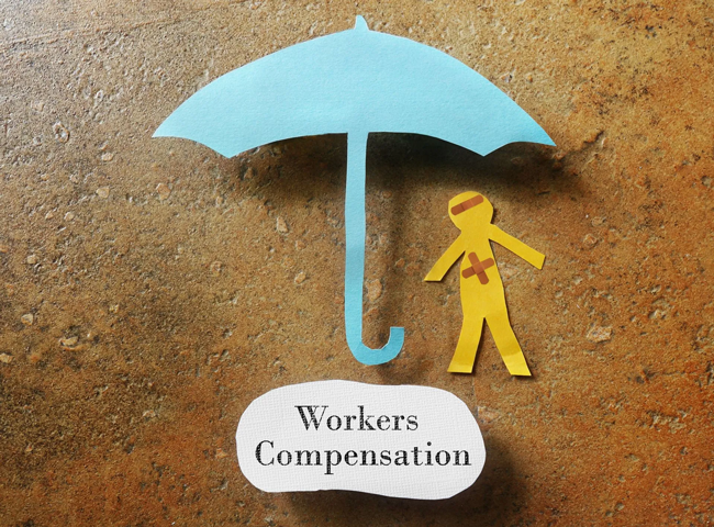 Workers' compensation concept with paper umbrella and injured figure on textured background. 