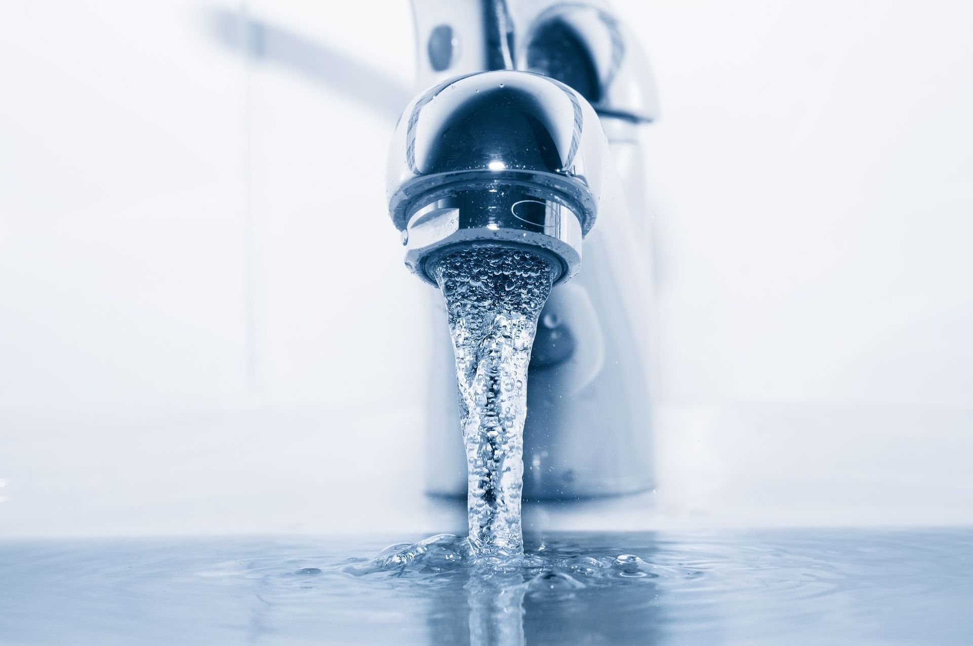 faucet flowing water closeup