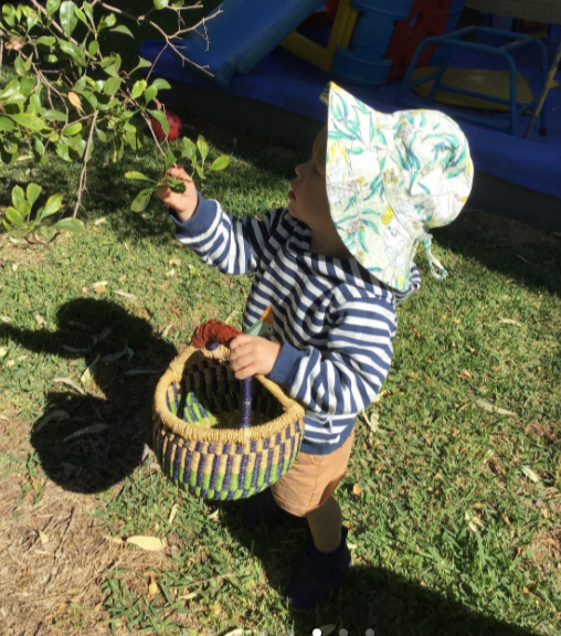Boy with a basket — Gap Community Child Care Centre In Alice Springs, NT