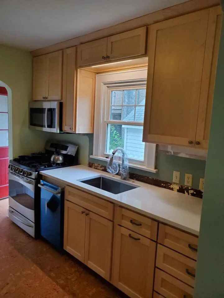 Kitchen with stove and oven — Onalaska, WI — Noble Custom Woodshop LLC